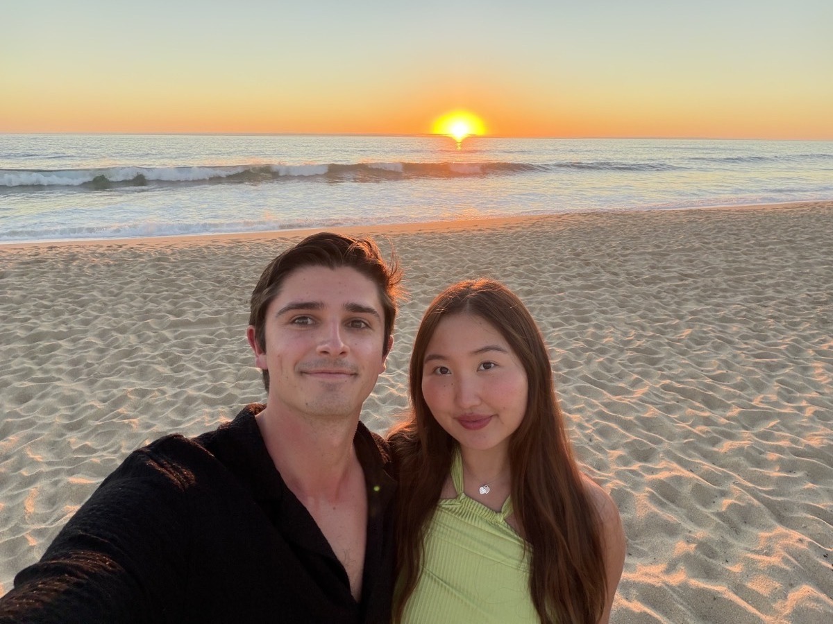 Ian and Annie, owners of Spotless SF, at sunset on the beach